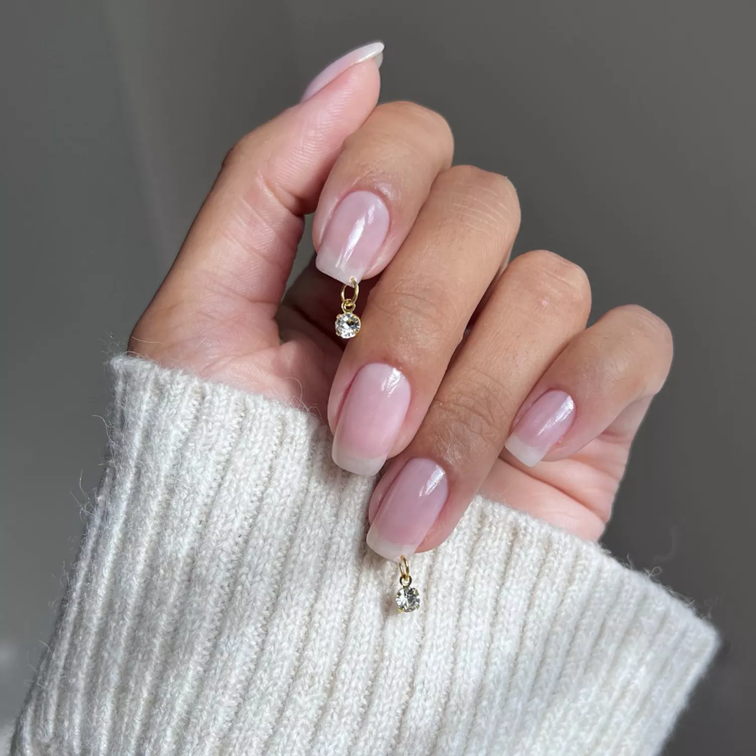 A soft French set finished with small gold charms, created at Glory