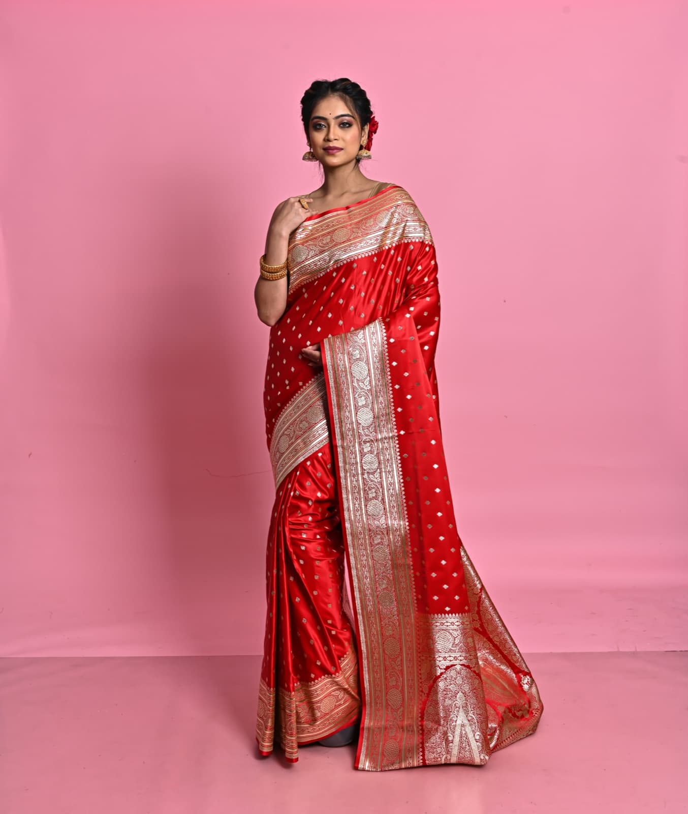 A client styled and draped in a red Banarasi silk saree at Glory